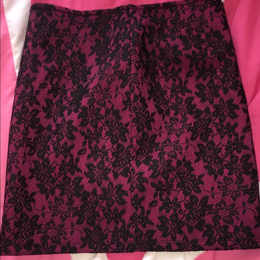 A purple/pink skirt detailed w black lace